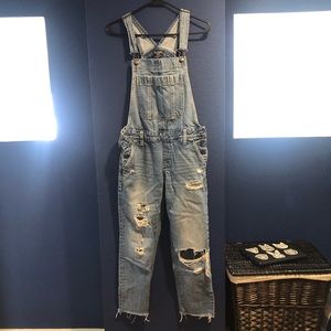 Ripped jean overalls